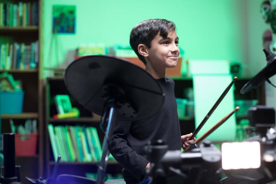 Boy playing drums