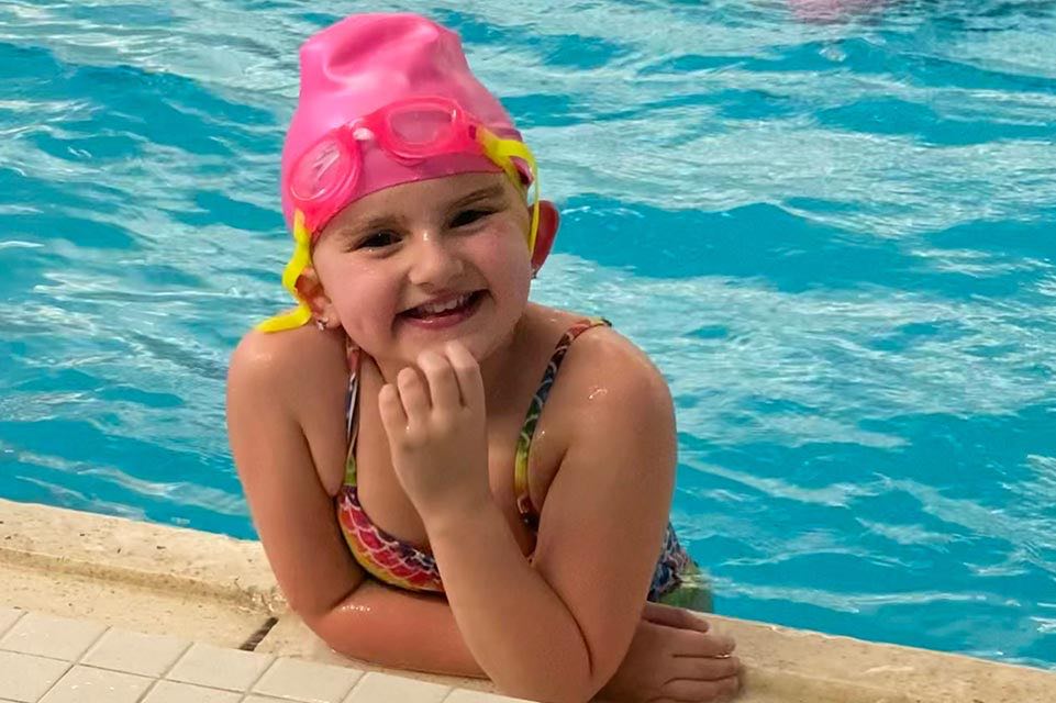 Little girl in swimming pool